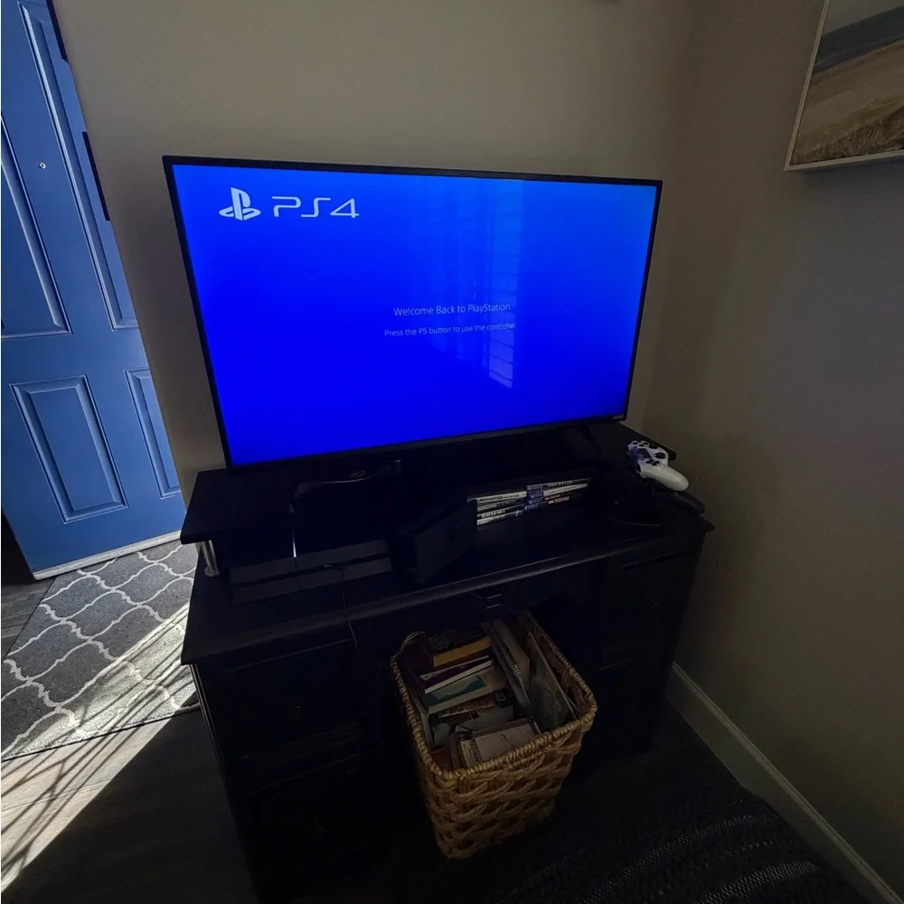 Sony PlayStation 4 with 2 Controllers and 8 Games